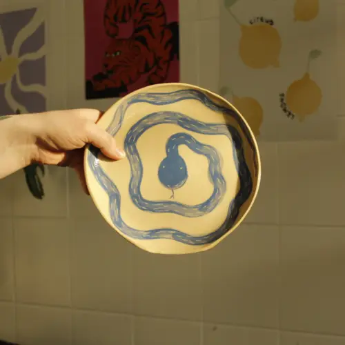 Round Plates with Blue Snakes