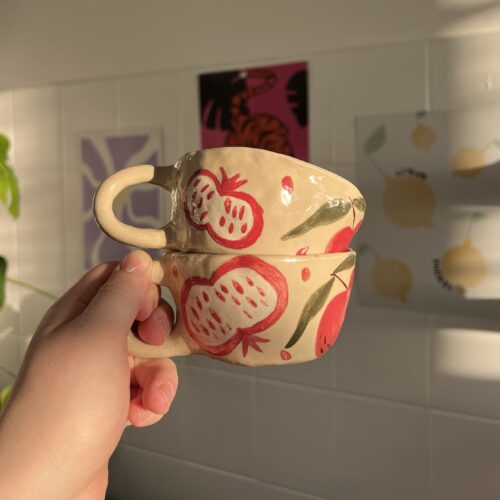 Cup with pomegranate