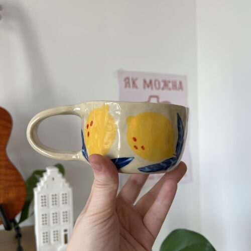 Cup with lemons